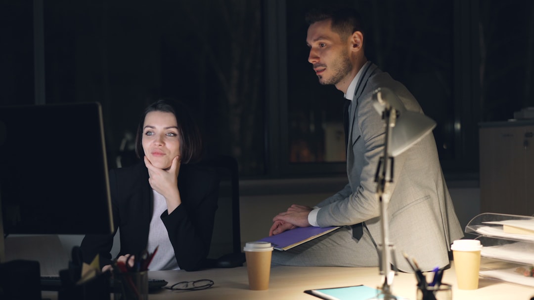 UK accounting firm team managing peak season workload together in the office