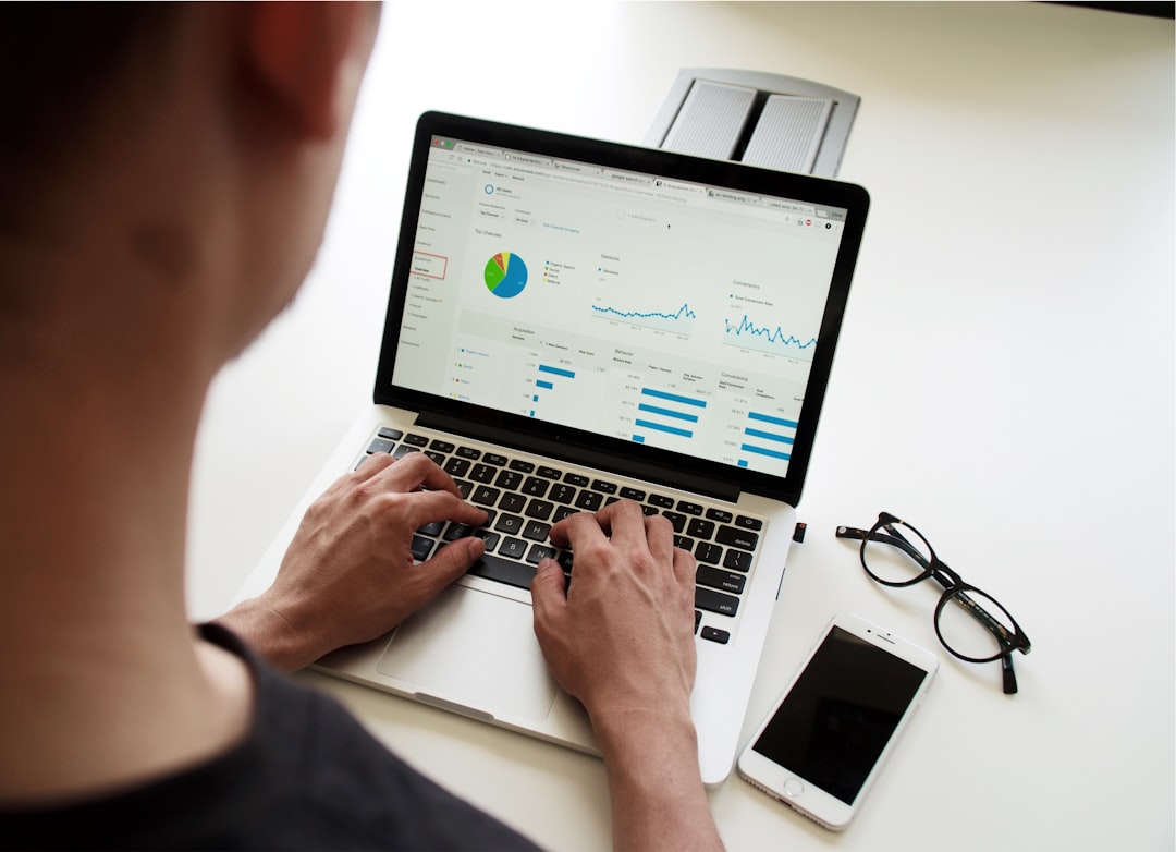 Accountant reviewing UK accounting standards changes for FRS 102 on a laptop